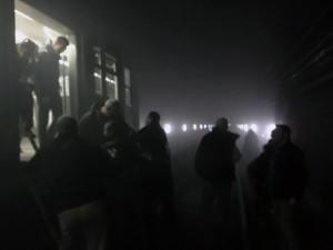 In this photo provided by EurActiv and photographed by Evan Lamos, passengers on the metro leave their carriages and walk along the tracks following an attack on the Brussels underground transport system in Brussels, Belgium, after an explosion, Tuesday, March 22, 2016. Scores of people are dead after explosions hit Brussels airport and the city's Maelbeek metro station Tuesday morning. (Evan Lamos/EurActiv, via AP)