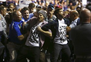 Protesters are removed from a Donald Trump rally at the Crown Center Coliseum in Fayetteville, N.C., March 9, 2016. A number of the violent incidents at Trumpís raucous rallies have had racial overtones. (Travis Dove/The New York Times)