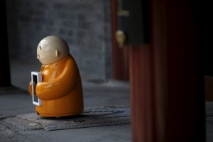 Robot Xian'er is placed in the main building of Longquan Buddhist temple for photographs by the temple's staff, on the outskirts of Beijing, April 20, 2016.  REUTERS/Kim Kyung-Hoon