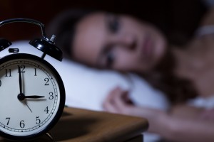 Close-up of alarm clock on night table